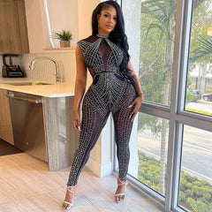 Combinaison moulante sans manches à empiècement en maille transparente et détails en cristal scintillant