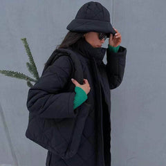 Oversize-Pufferjacke mit Rautensteppung und langen Ärmeln - Schwarz