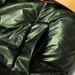 Dunkelgrüne, übergroße Pufferjacke mit unregelmäßigem Saum