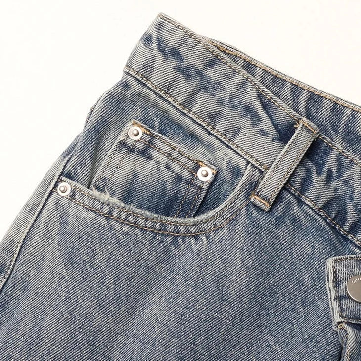 JEANS À FERMETURE IRRÉGULIÈRE