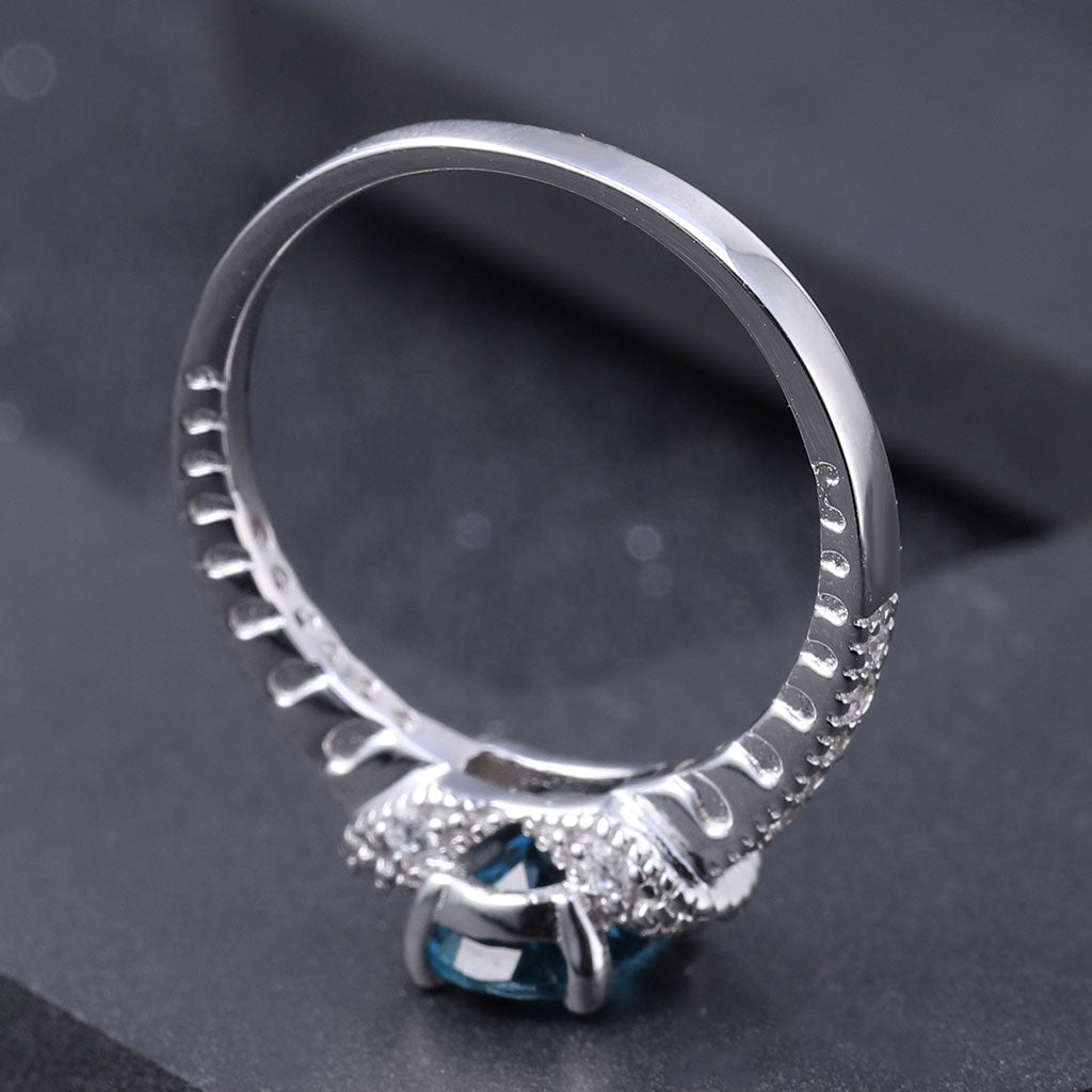 Opulent Clear Cubic Zirconia London Blue Topaz Halo Ring