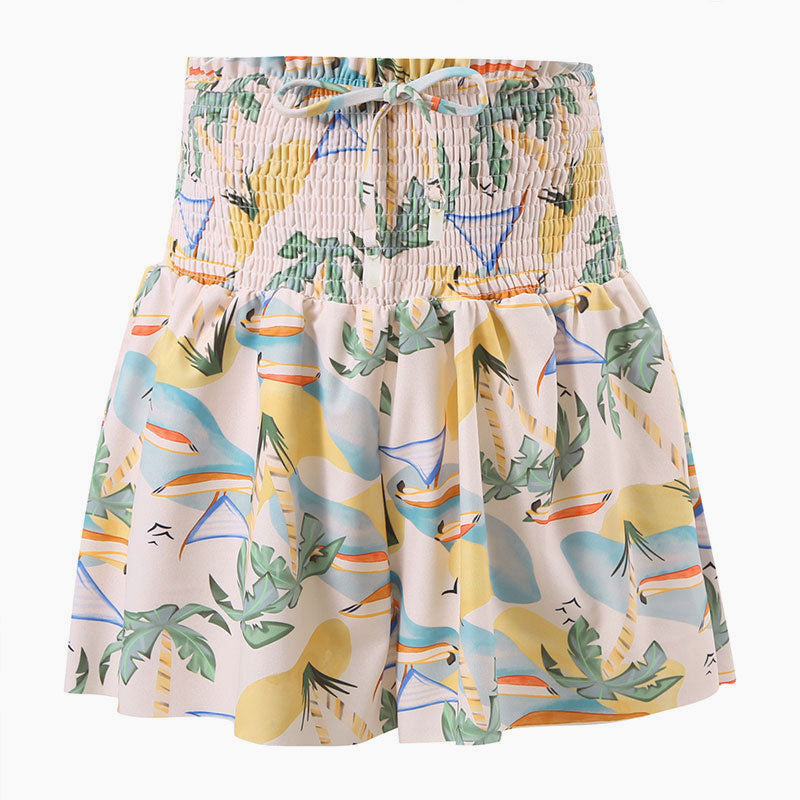 Mini-jupe froncée taille haute à volants et nœud papillon avec cordon de serrage et motif feuilles tropicales