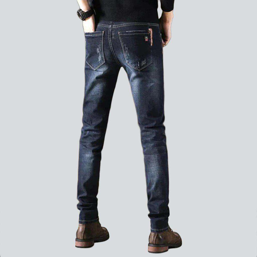 Jean skinny à moustaches pour homme