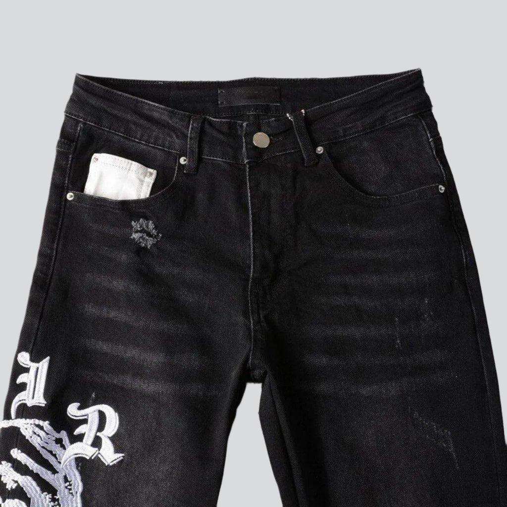 Schwarze Skinny Jeans mit weißer Stickerei