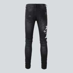 Schwarze Skinny Jeans mit weißer Stickerei