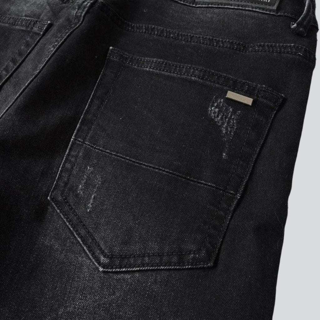 Jean skinny noir avec broderie blanche