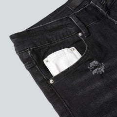 Jean skinny noir avec broderie blanche