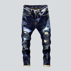 Whiskered distressed jeans for men