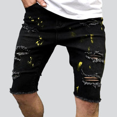 Gelb lackierte Distressed-Jeansshorts